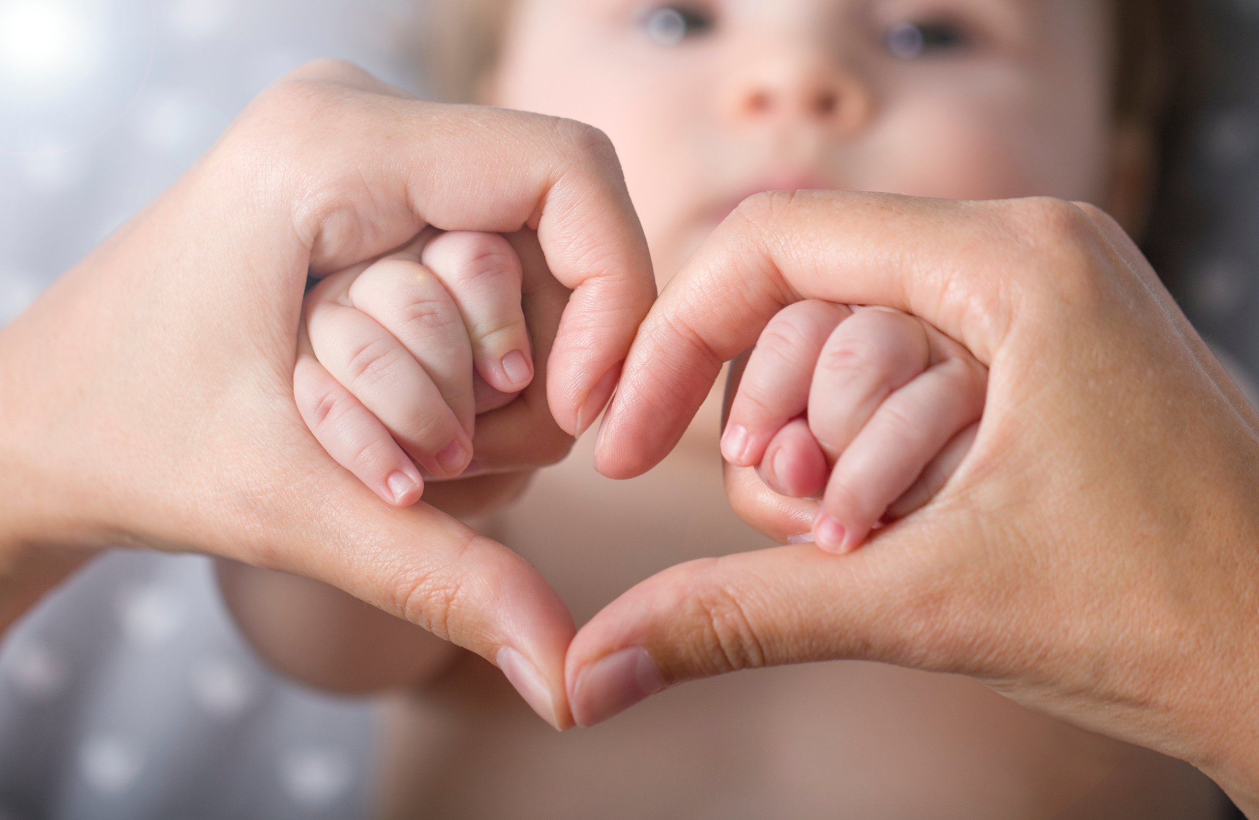 Newborn,Baby,Holding,Mother,Hands,In,Heart,Shape,,,Closeup